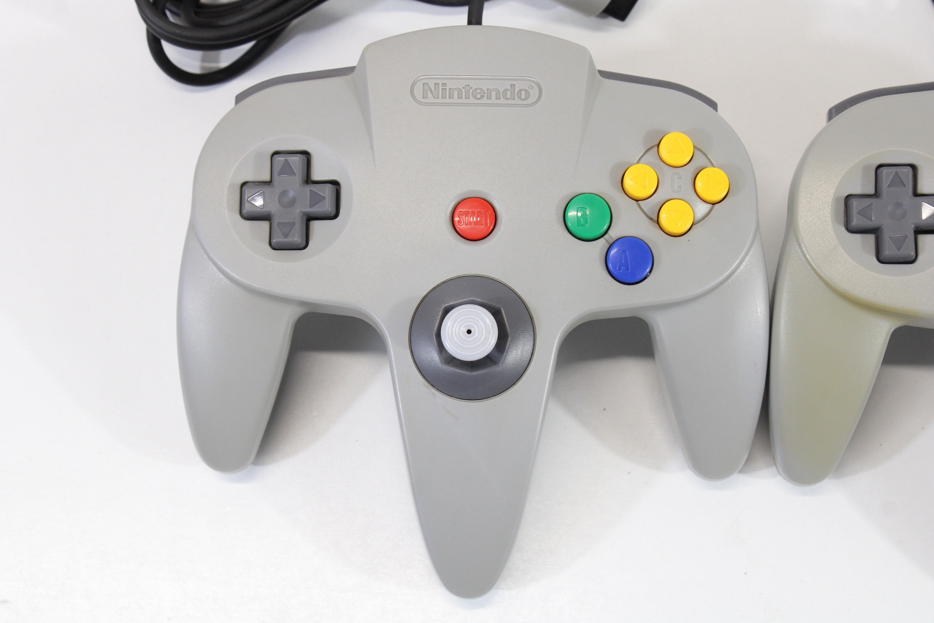 Lot of 2 Official Nintendo 64 Controllers Gray 7/10 Tight Stick (Discolored / Cosmetic Wears) N64