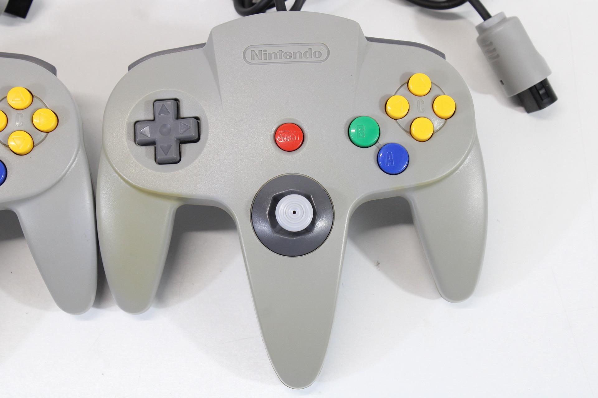 Lot of 2 Official Nintendo 64 Controllers Gray 7/10 Tight Stick (Discolored / Cosmetic Wears) N64