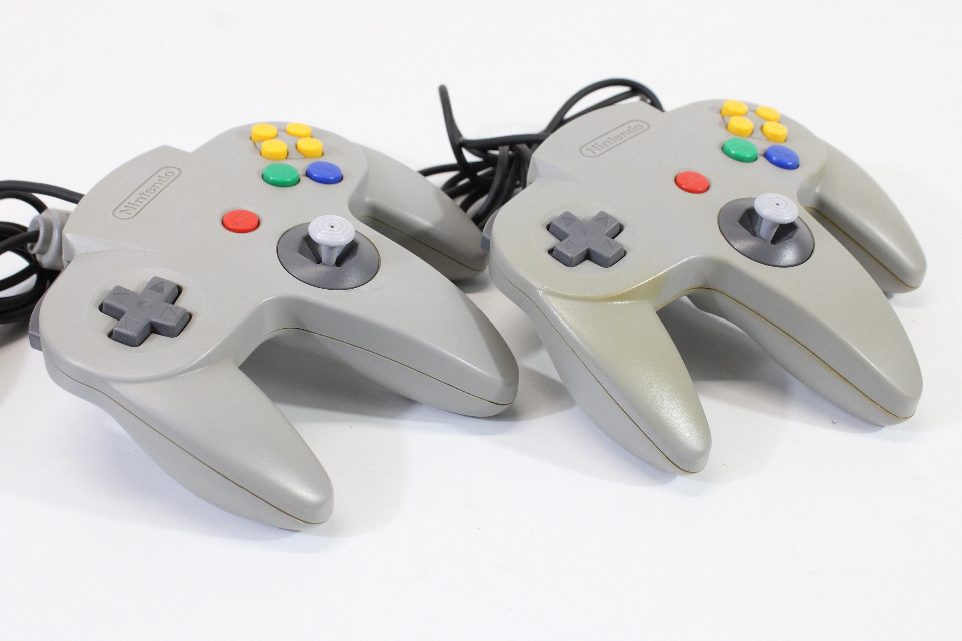 Lot of 2 Official Nintendo 64 Controllers Gray 7/10 Tight Stick (Discolored / Cosmetic Wears) N64