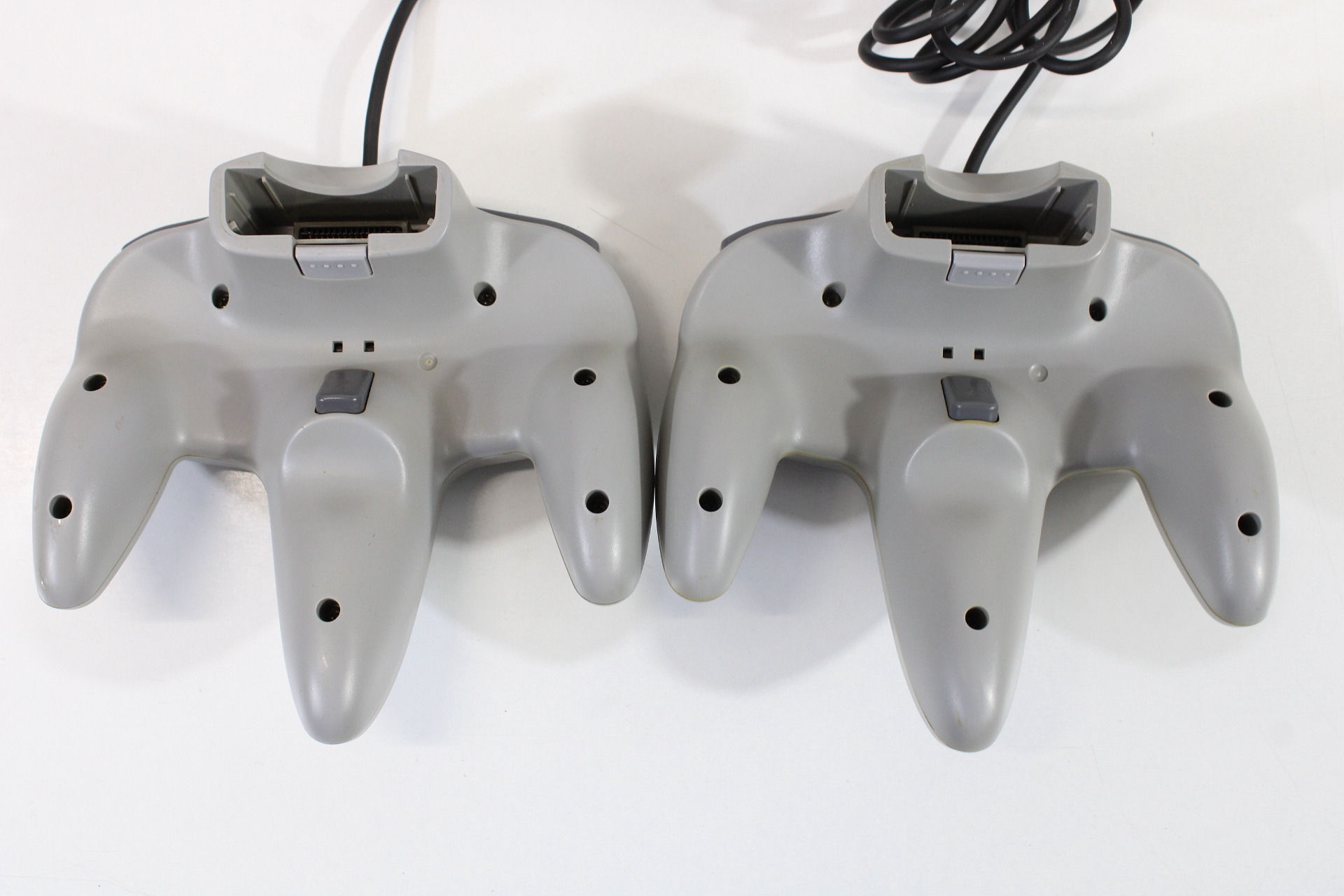 Lot of 2 Official Nintendo 64 Controllers Gray 7/10 Tight Stick (Discolored / Cosmetic Wears) N64